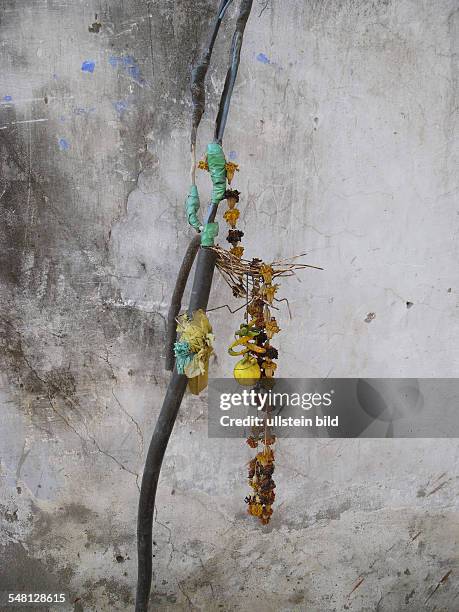India Delhi New Delhi - outdoor electricity cable provisionally repaired and blessed with flowers