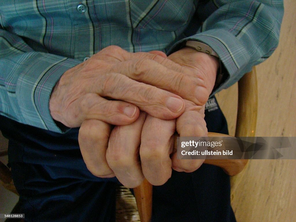 Symbolic photo home for the aged, old man with a walking stick