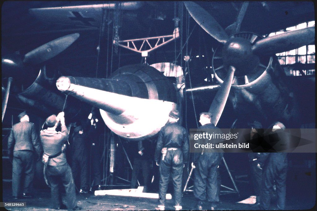 World War II Mounting explosives on a JU 88 aircraft of the German air force - no place given - 1944/45 - Photographer: ullstein - Sobotta -