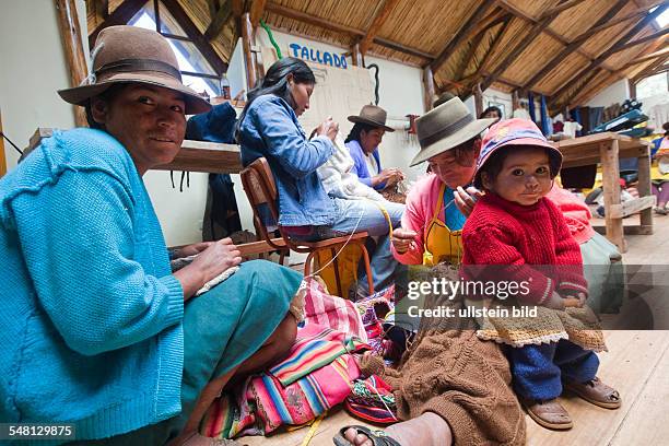 Peru - Yaurisque: Development project of CECADE : villagers get trained in renewable energies and traditional handicrafts. Women in textile work.