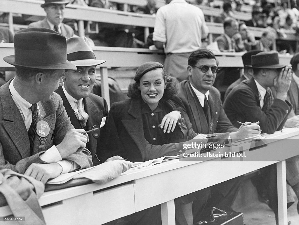 Germany Free State Prussia Berlin : 1936 Summer Olympics Eleanor Holm-Jarret, disqualified US swimmer, at the press gallery as reporter for the Hearst broadcasting company - August 1936 - Vintage property of ullstein bild