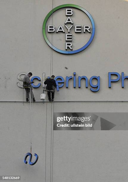 Germany Berlin Wedding - removing the lettering Schering from the front of the Berlin headquarters at Muellerstrasse, now Bayer AG