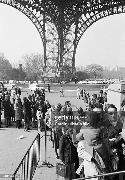 Tourism, queue of people at the elevator to the observation platform on the Eiffel Tower, France, Paris -