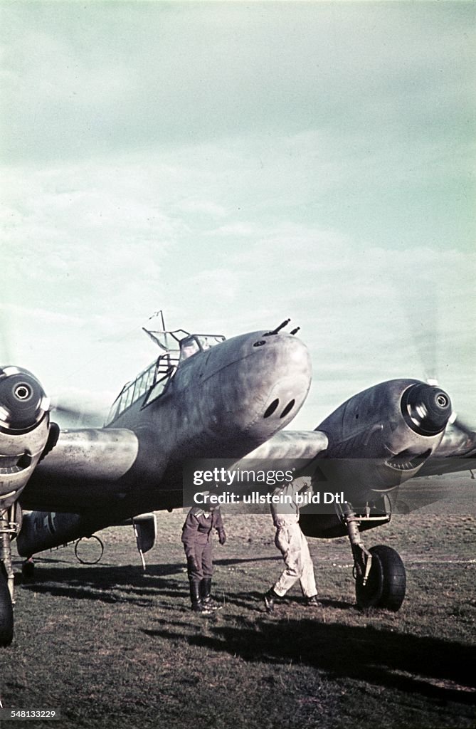 Italy : World War II Making a German heavy fighter Messerschmitt Bf - 110 ready for takeoff at an airfield in Italy (probably South Italy) - 1942 - Photographer: Artur Grimm -