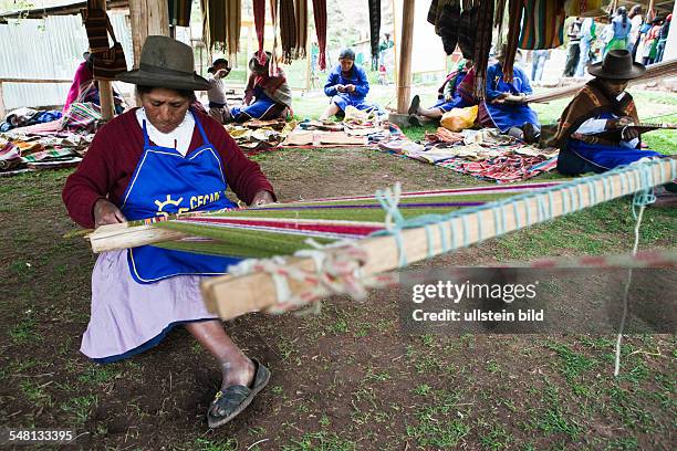 Peru - Yaurisque: Development project of CECADE : villagers get trained in renewable energies and traditional handicrafts. Women in textile work.