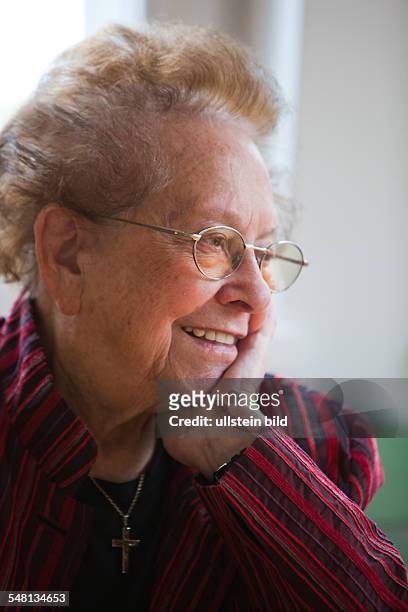 Elderly woman is contemplative -