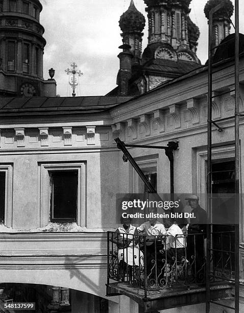 Soviet Union Russian SFSR Moscow: Students of the Moscow University making music on the balcony of their flat - around 1925 - Photographer: James E....