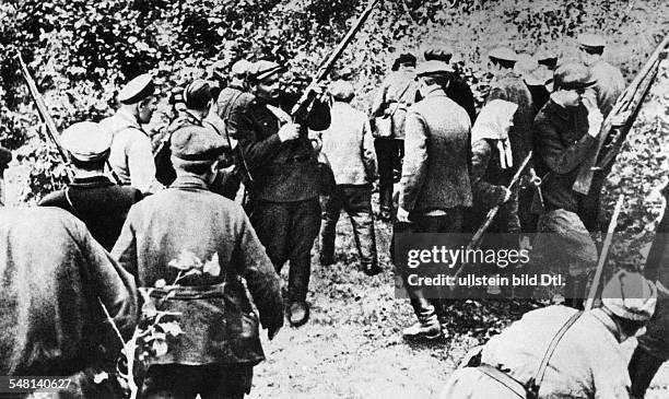 World War II Operation Barbarossa: handing out weapons to partisans after the German attack on the Soviet Union on June 22, 1941 - August 1941 -...