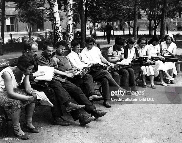 Soviet Union Russian SFSR Moscow: Students of the Moscow University sitting on a park bench one day before the end of the term - around 1925 -...