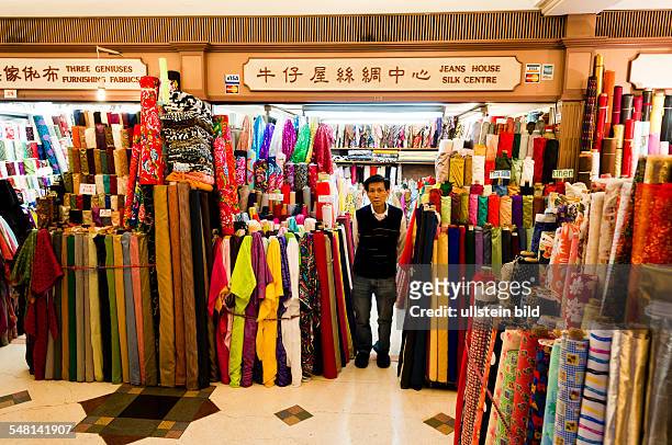 China Hongkong Tseun Wan - Western market, vendor is selling cloth, especially silk