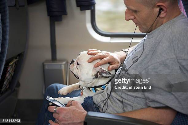 Germany passanger with dog is driving in a train -