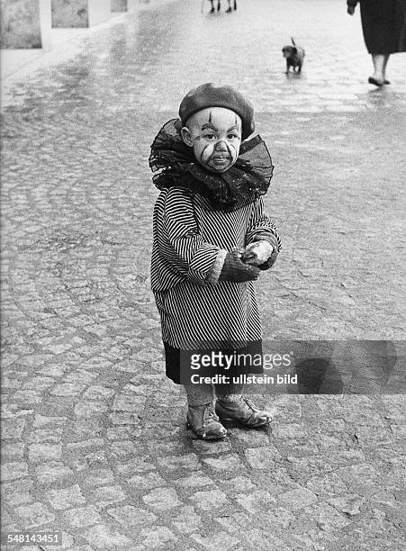 Federal Republic of Germany Bavaria Munich: Scenes from the Munich Carnival - little boy in fancy dress standing alone on the street - 1971 -...