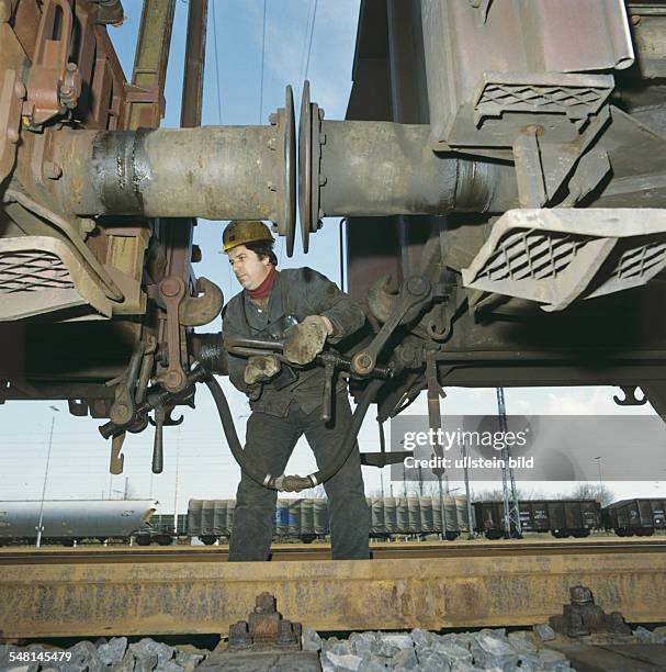 Germany - A worker of the railway company 'Deutsche Bahn' is shunting cars of a train - no date, caption approximately 1980s