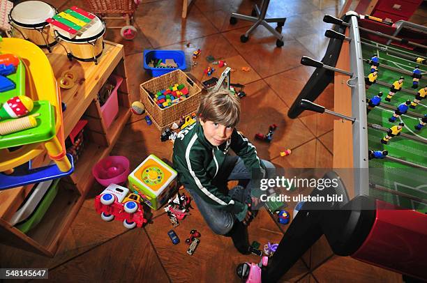 Germany Berlin - boy in his untidy room -