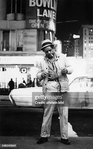 New York: man with a cigarette at Times Square, 42nd Street - 1970