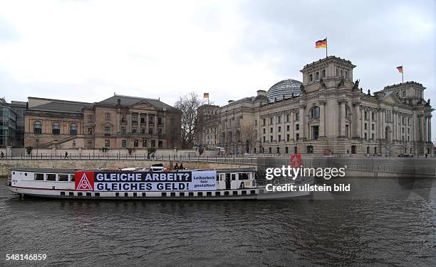 Germany Berlin Mitte - Protest trip for minimum wages of the Industrial Union of Metalworkers with a banner 'Gleiche Arbeit? Gleiches Geld!' on the...