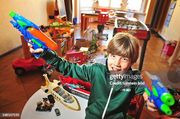 Germany Berlin - boy in his untidy room -