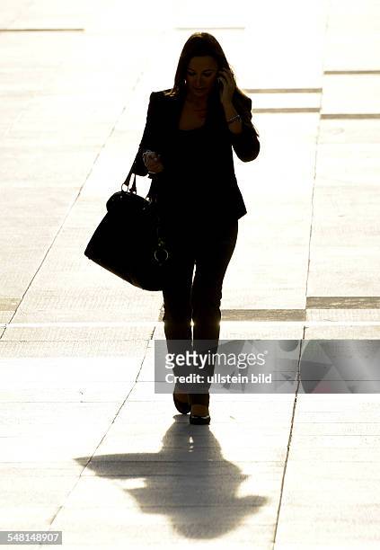 France Ile de France Paris - Silhouette of a woman with a bag