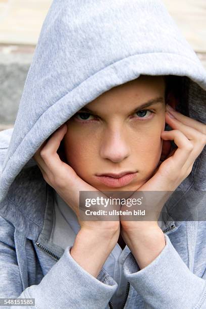 Young man wearing a sweater with hood - 2010