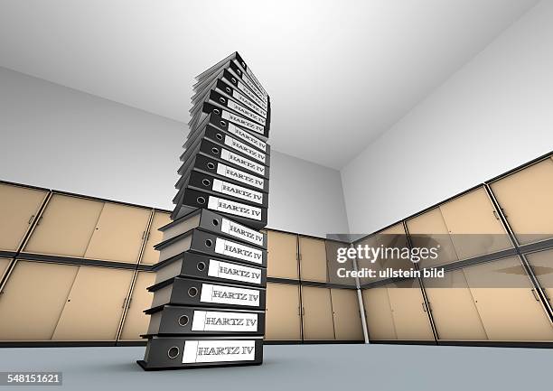 Pile of files with labelling - Hartz IV - in front of file cabinets