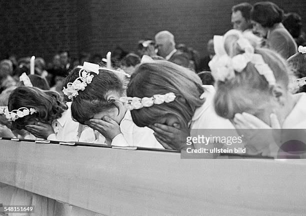 Religion, Christianity, First Communion, four girls pray in the pew after receiving the Holy Communion, aged 8 to 12 years, Babette -