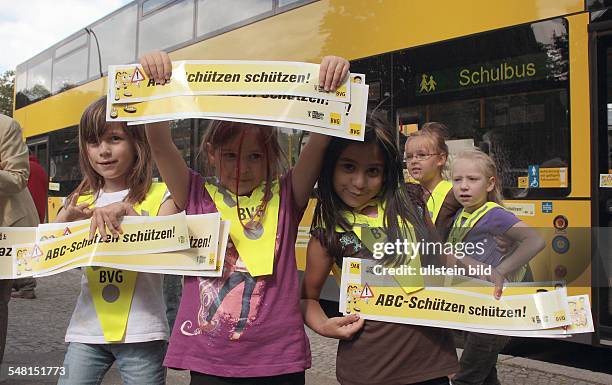 Germany Berlin Wilmersdorf - pupils of the Astrid-Lindgren-School at road safety education; high-visibility jacket for first grader -