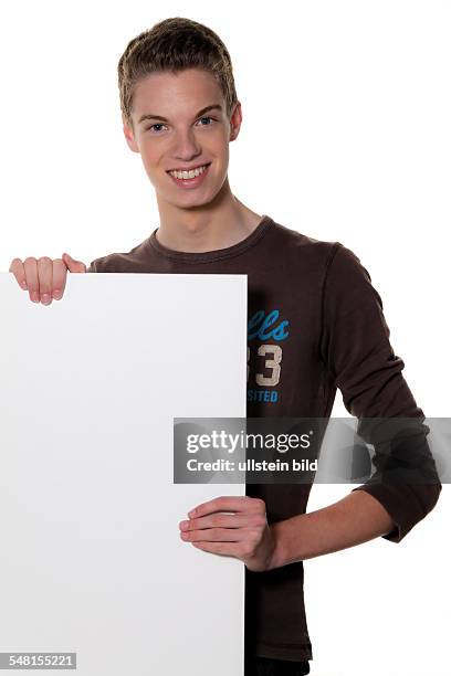 Young man with blank poster - 2010