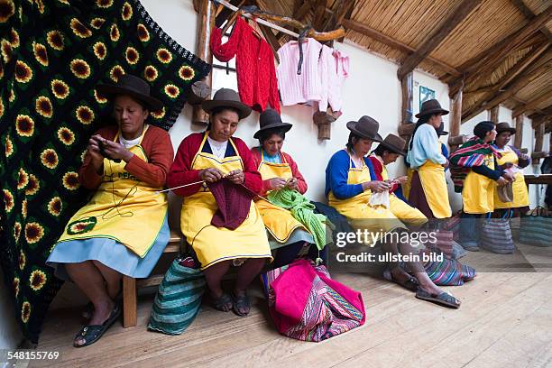 Peru - Yaurisque: Development project of CECADE : villagers get trained in renewable energies and traditional handicrafts. Women in textile work.