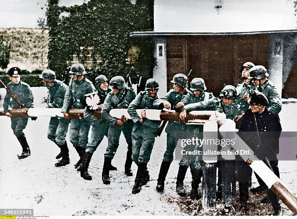 On the morning of 1 September 1939, the first day of World War II, German soldiers remove the barrier at the German-Polish border on the road to...