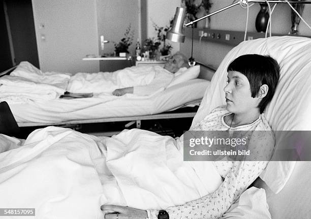 People, health, young woman lies in a sickbed of a hospital, beside her lies a older woman, aged 25 to 30 years, aged 70 to 80 years, Monika -