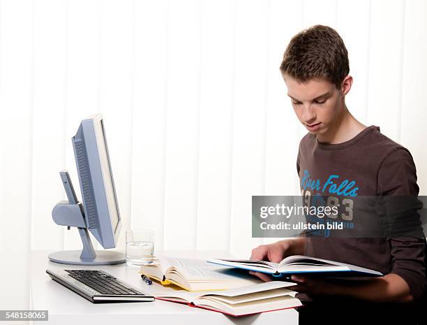 Young man with books and computer - 2010