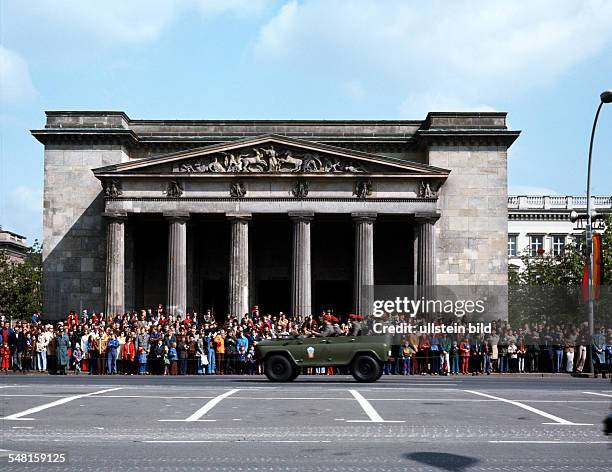 German Democratic Republic Bezirk Berlin East Berlin - A military parade "Unter den Linden" in front of the cenotaph "Neue Wache" in the background.