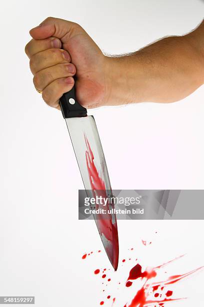 Symbolic photo crime, murder, bloody knife - 2010