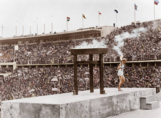 Germany, Berlin - Olympic Games 1936 - The last torch bearer of the Olympics at Berlin, long-distance runner Fritz Schilgen, standing on the platform...