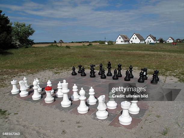 Germany Mecklenburg-Western Pomerania Hiddensee - outdoor chess, in the background thatched houses