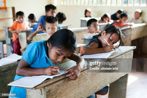 Ecuador Curaray - primary school in a village without any road connection in the rainforest of the Oriente, 150 km east of Puyo. Students learn to...