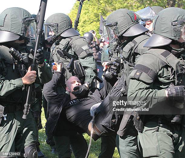 Germany Saxony-Anhalt Halle - May Day protest, protest march of right-wing extremists, police is arresting a protester -
