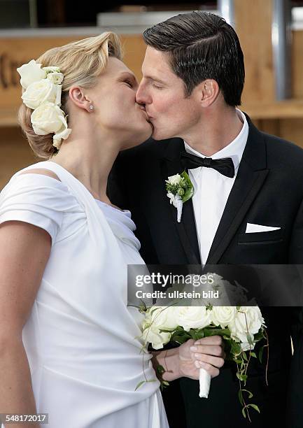 Riesch, Maria - Alpine Skier, Germany - and her husband Marcus Hoefl after their church wedding in Going, Austria