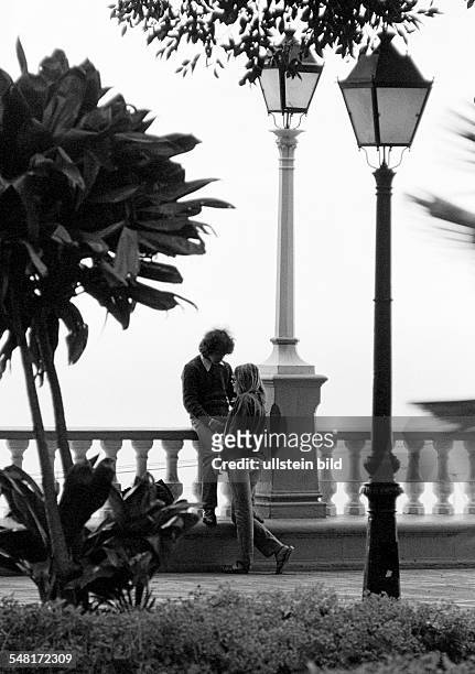 People, young couple stands close together, affection, idyllic, lanterns, balusters, aged 17 to 20 years, Spain, Canary Islands, Canaries, Tenerife,...