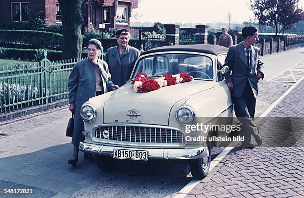 German Democratic Republic Bezirk Halle Steglitz - Family from West-Germany visiting their relatives, family with their Opel Rekord