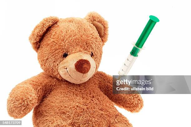 Symbolic photo teddy bear with injection