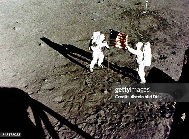 Neil Armstrong and Buzz Aldrin raise the American Flag on the Moon - NO COMMERCIAL USE!