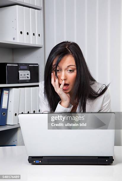 Symbolic photo computer virus, woman having problems with her laptop
