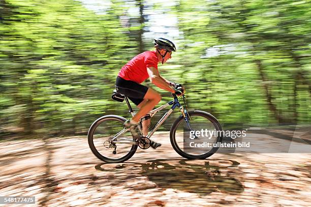 Senior on a Mountain Bike in the forest