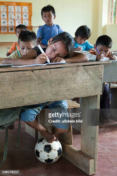 Ecuador Curaray - primary school in a village without any road connection in the rainforest of the Oriente, 150 km east of Puyo. Students learn to...