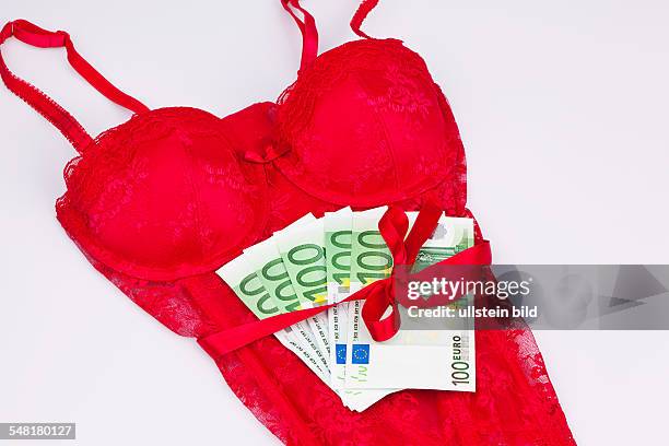 Symbolic phptp prostitution , red dessous with banknotes