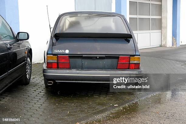 Repair shop, old SAAB 900 sports car from the 1980s