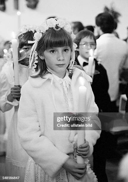Religion, Christianity, First Communion, during the procession to the church girls and boys hold communion candles in the hands, aged 8 to 12 years -