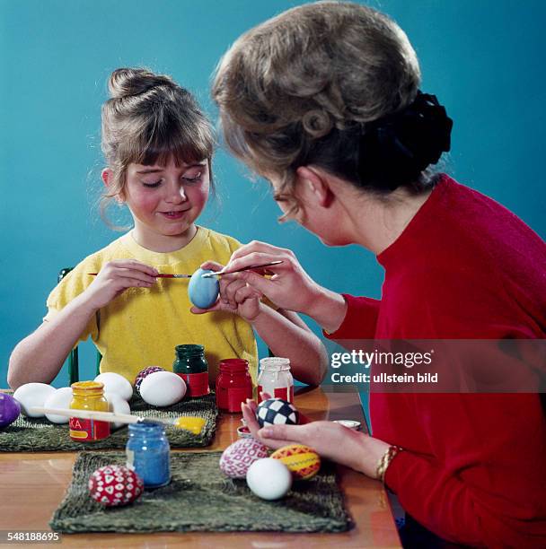 Germany Bavaria - Mother and daughter painting Easter eggs - 1960ies