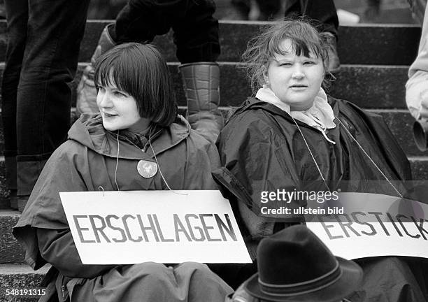 People, peace demonstration, Easter marches 1983 in Germany against nuclear armament, two young women presenting a protest sign, aged 20 to 30 years,...